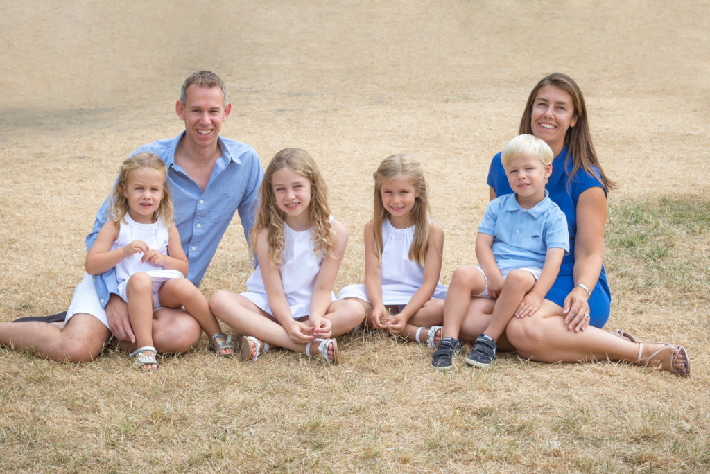 Parents with their four kids at family photography session on Clapham Common, South West London