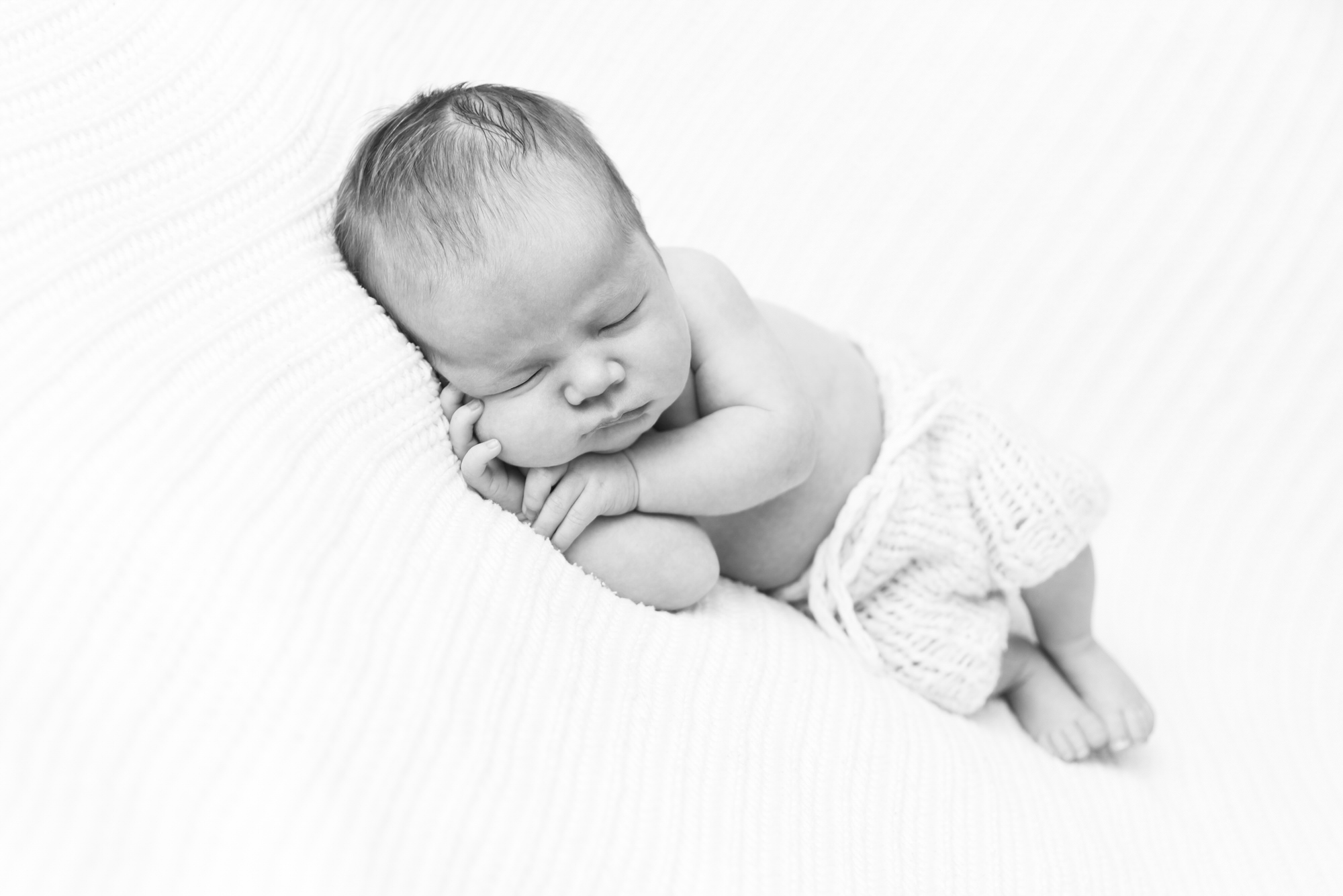 Black and white baby on side by Crystal Palace South London newborn photographer