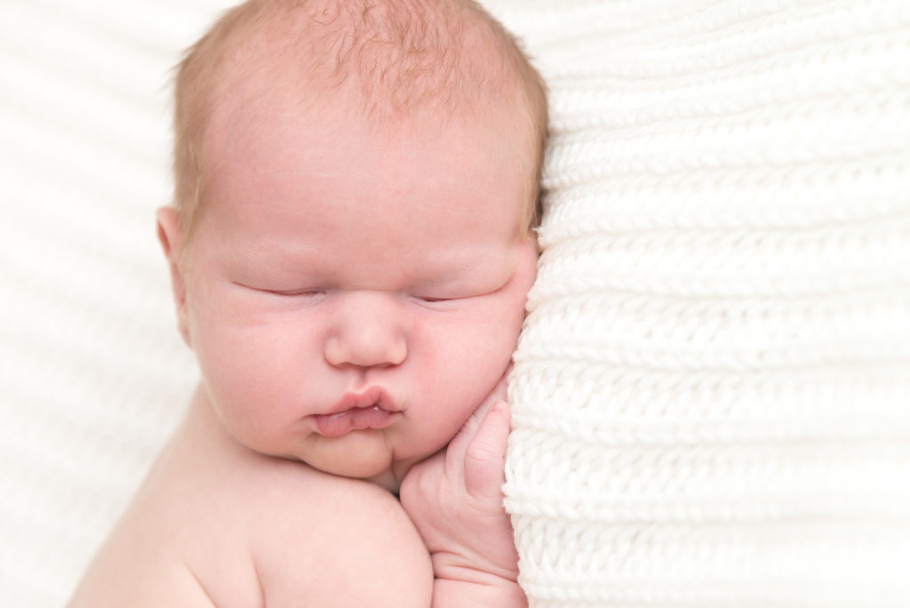 Photo of gorgeous sleeping newborn baby in Wimbledon